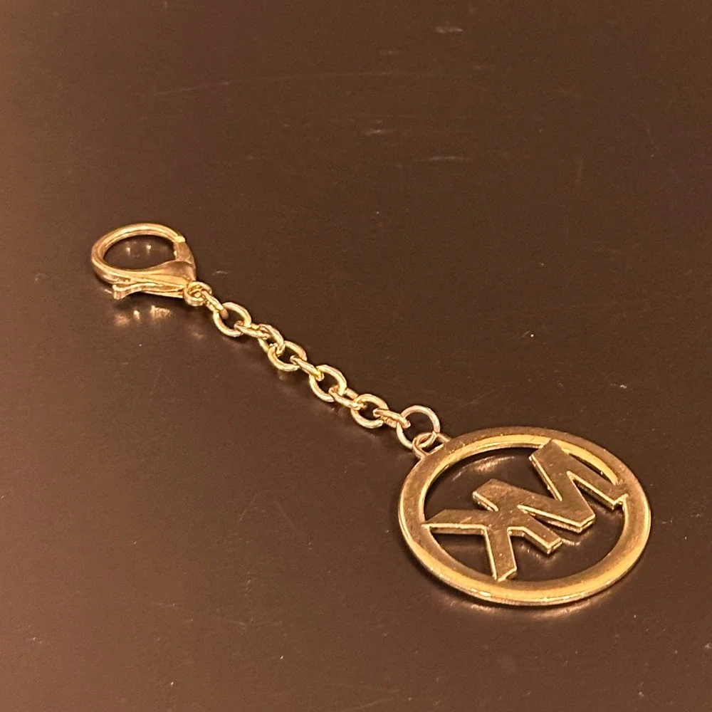 Michael Kors MK Logo Bag Charm Keychain Gold Tone Circular Medallion Accessory